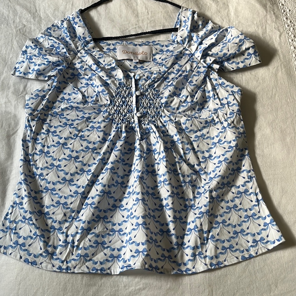 Dondolo blue bow blouse with cap sleeves, size M